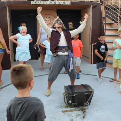 kids and Buccaneer crew members on deck