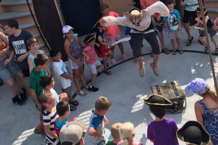 a group of people performing on stage in front of a crowd