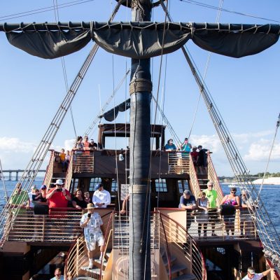 a boat is docked next to a body of water