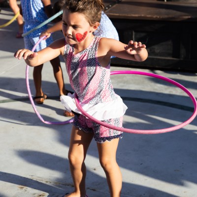 little girl hula hooping on the deck of the Buccaneer