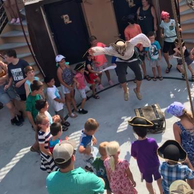 a group of people performing on stage in front of a crowd
