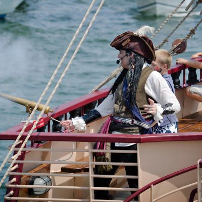 a group of people riding on the back of a boat
