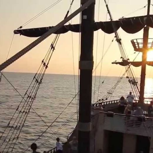 a boat is docked next to a body of water