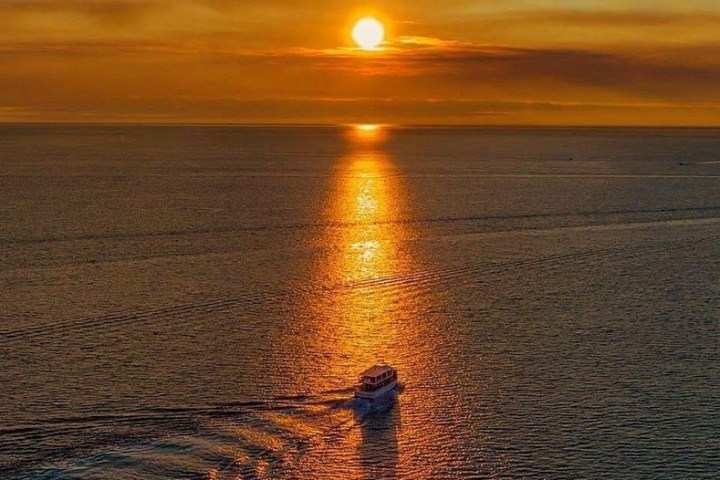 a sunset over a body of water